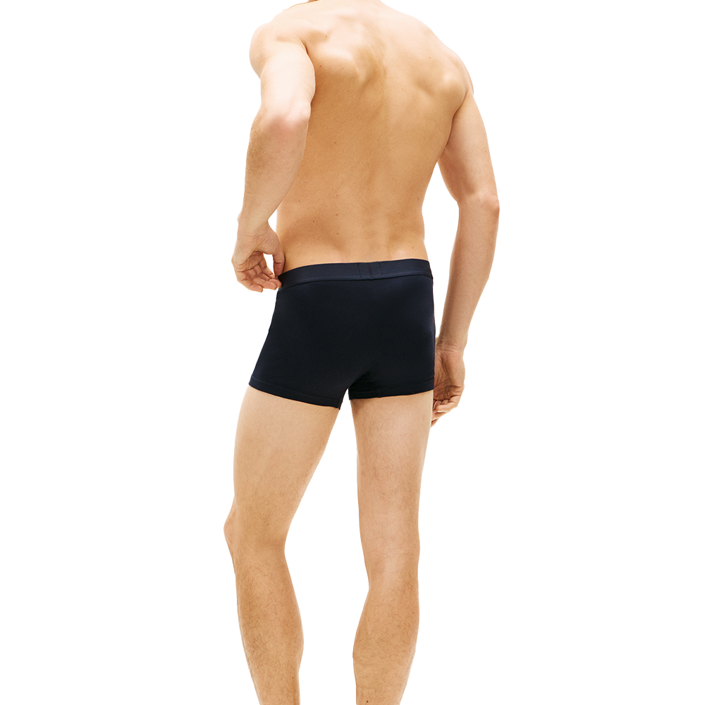 man wearing tommy hilifiger navy boxer trunks