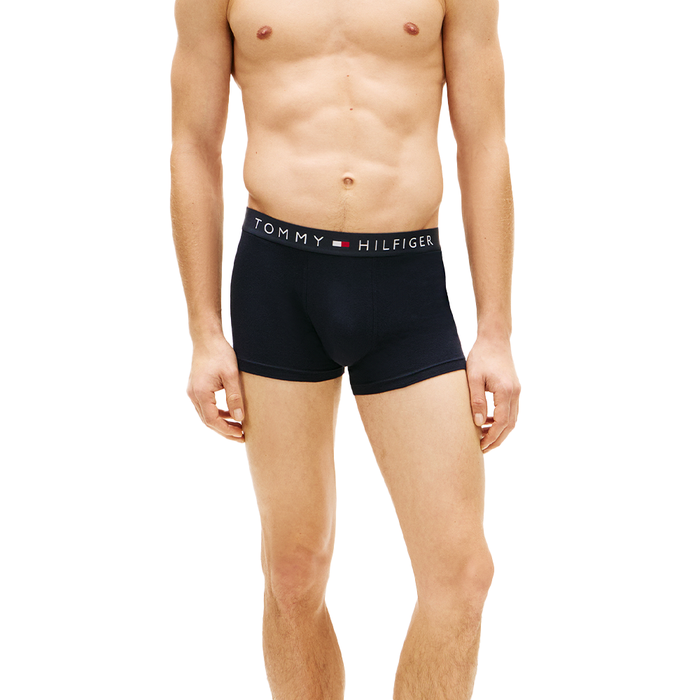 man wearing tommy hilifiger navy boxer trunks