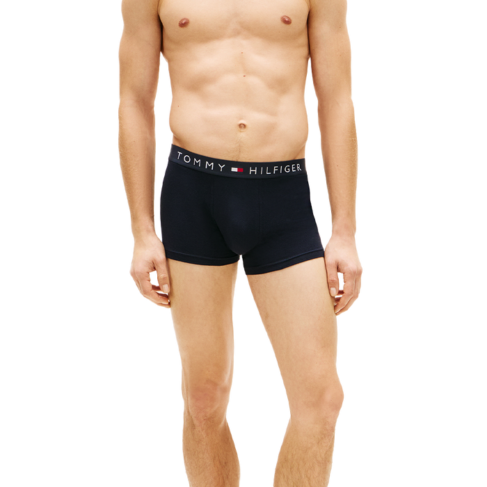 man wearing tommy hilifiger navy boxer trunks
