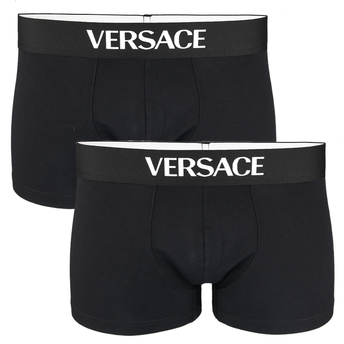 Two black Versace boxer trunks on a white background