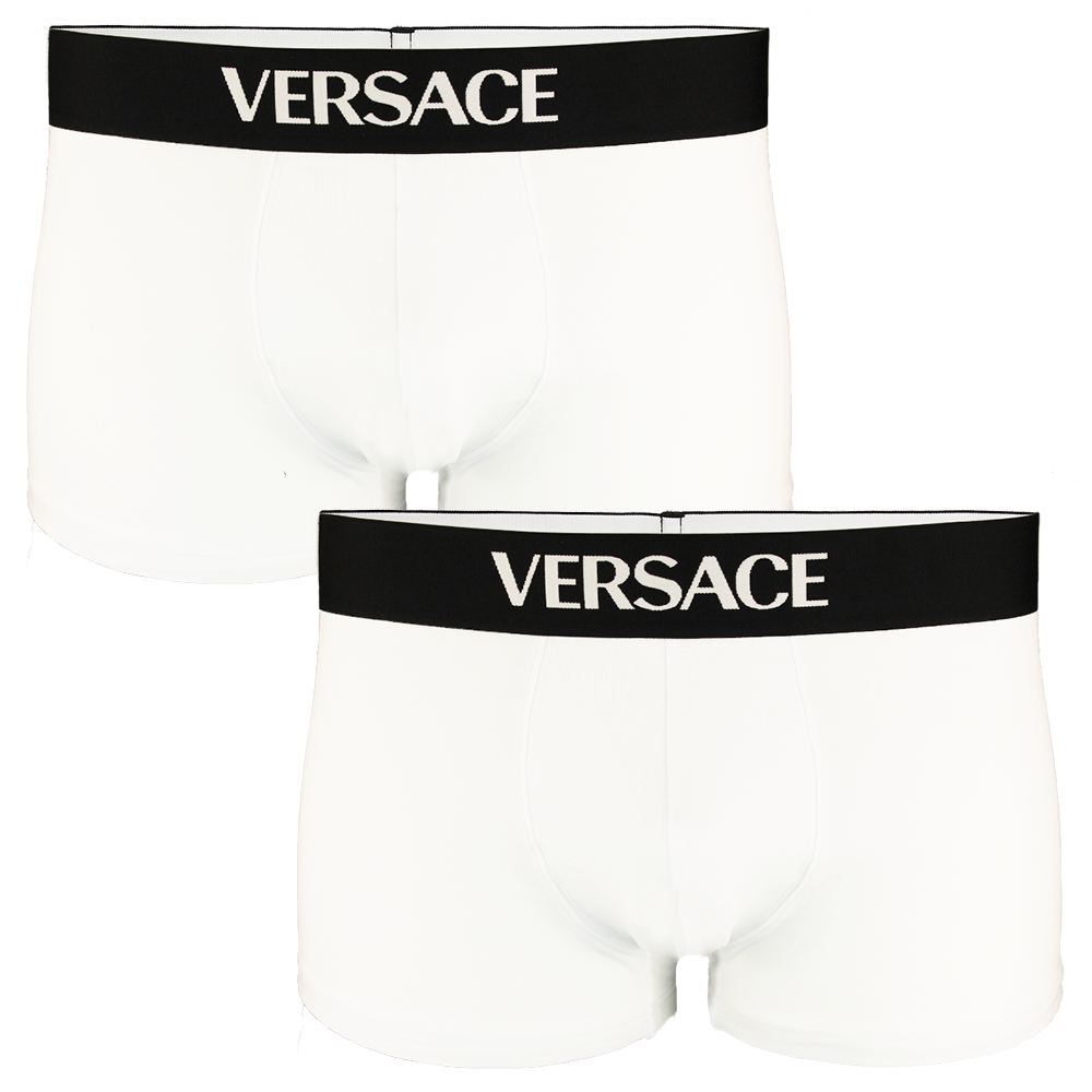Two white Versace boxer trunks with black waistbands on a white background