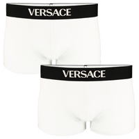 Two white Versace boxer trunks with black waistbands on a white background