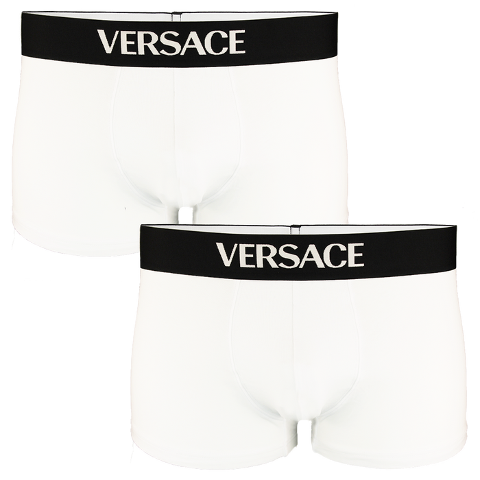 Two white Versace boxer trunks with black waistbands on a white background