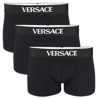 Three black Versace boxer trunks on a white background