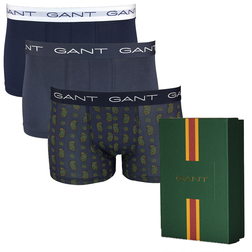 Three pairs of Gant boxer trunks with a green box featuring the Gant logo.