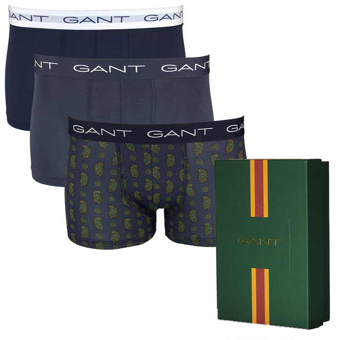 Three pairs of Gant boxer trunks with a green box featuring the Gant logo.