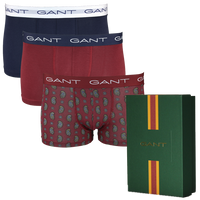 Three pairs of Gant boxer trunks in different colors with a green box featuring Gant branding.