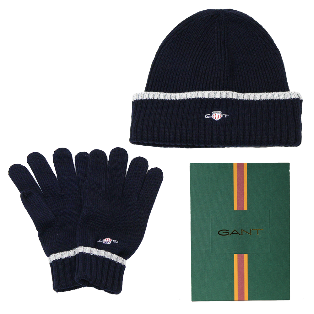 Navy beanie and gloves set with GANT logo on a white background