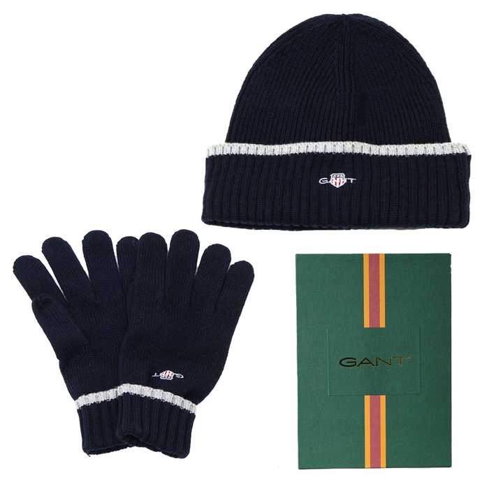 Navy beanie and gloves set with GANT logo on a white background