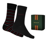 Black socks with red and white stripes and a Gant branded box on a white background