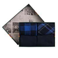 Set of men's socks in a decorative box with a patterned design.