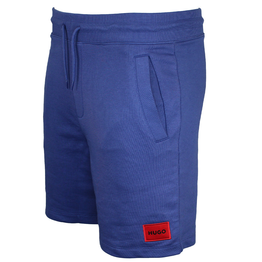 Blue shorts with a red patch on a white background