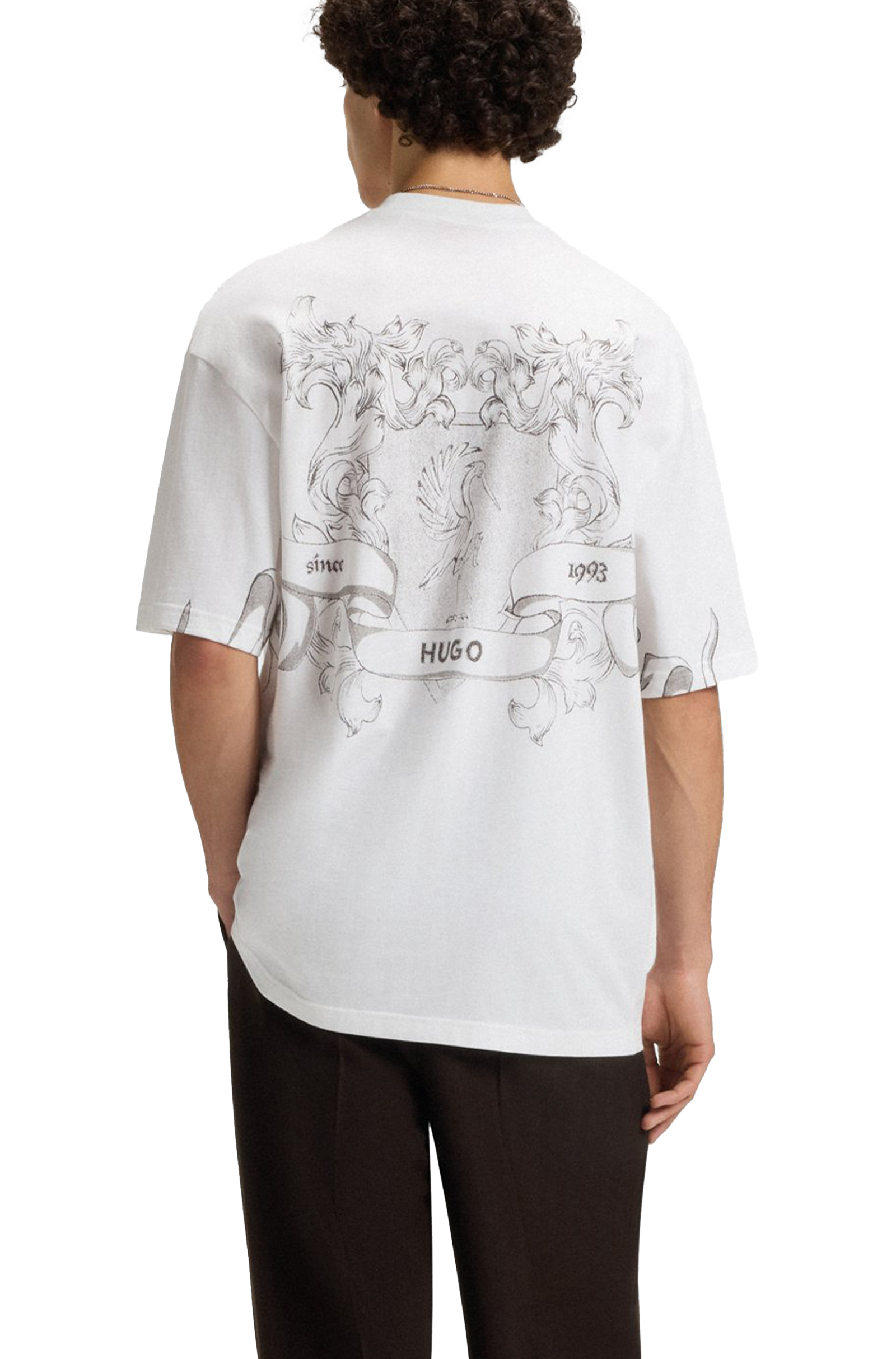 Person wearing a white t-shirt with black graphics and text, standing against a white background