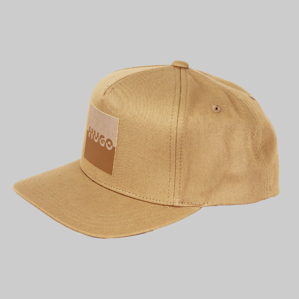 Beige cap with a patch on a white background
