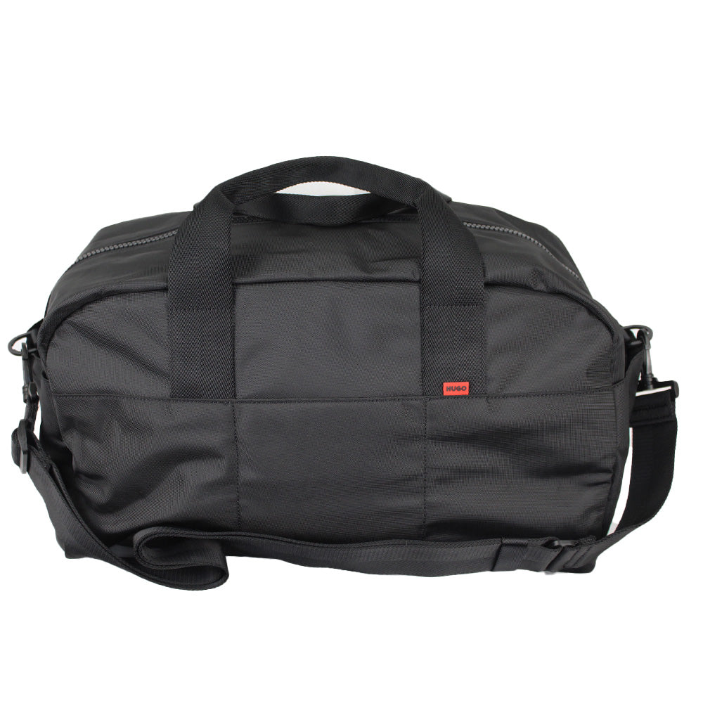 Black duffel bag with a red label on a white background