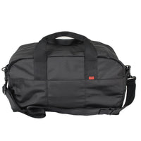 Black duffel bag with a red label on a white background