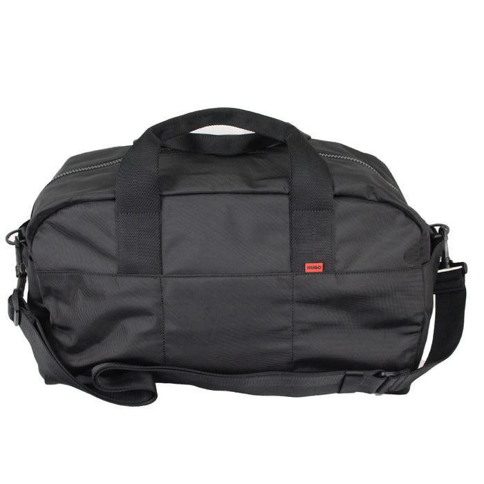 Black duffel bag with a red label on a white background