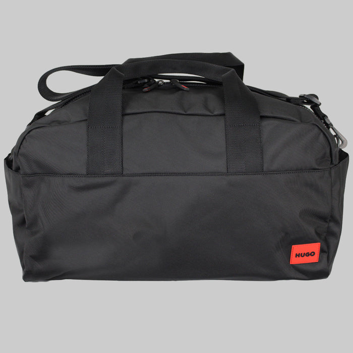 Black duffel bag with a red Hugo label on a white background