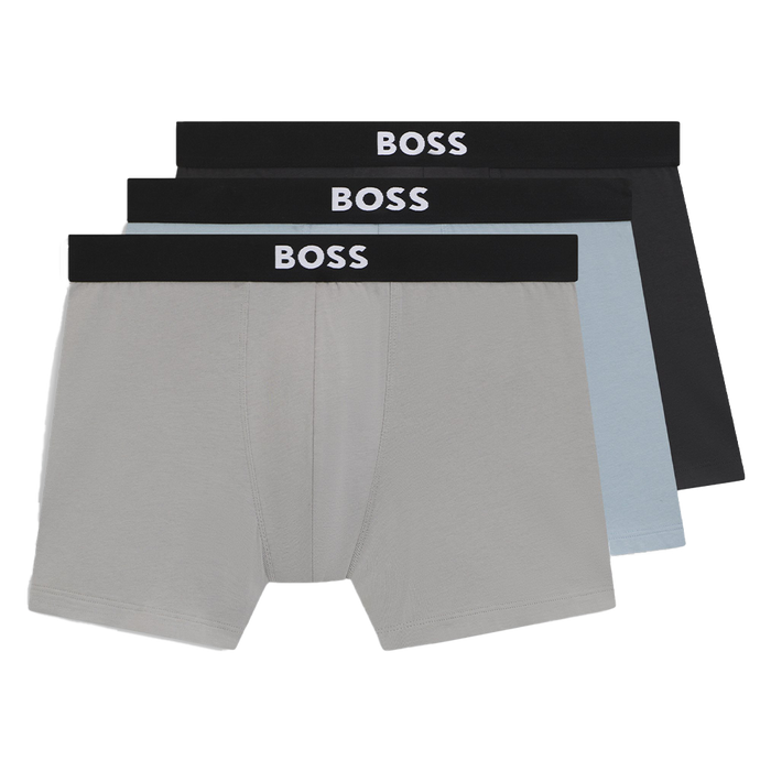 Three pairs of BOSS boxer briefs in gray, black, and light blue on a white background.