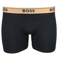 Black boxer briefs with a beige waistband featuring 'BOSS' branding on a white background.