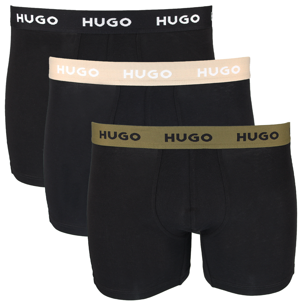 Three pairs of black boxer briefs with different colored HUGO brand waistbands on a white background.