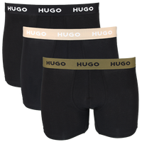 Three pairs of black boxer briefs with different colored HUGO brand waistbands on a white background.