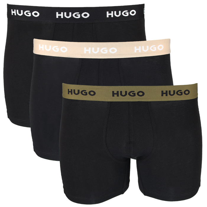 Three pairs of black boxer briefs with different colored HUGO brand waistbands on a white background.