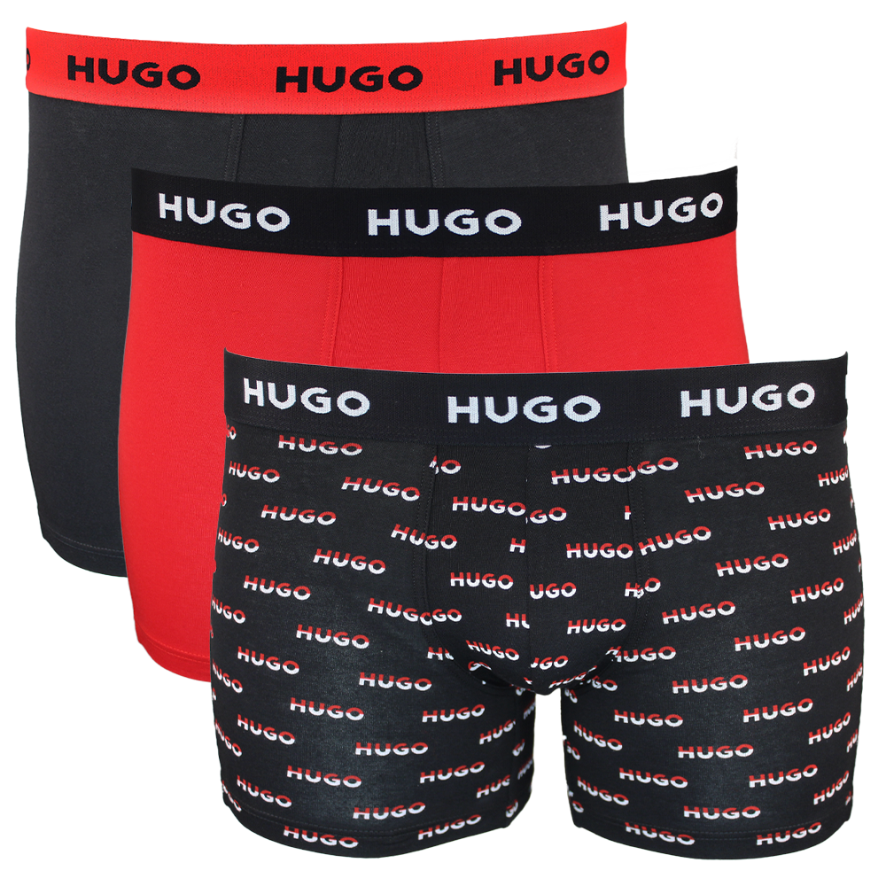 Three pairs of Hugo boxer briefs in black, red, and patterned designs on a white background.