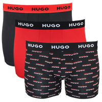 Three pairs of Hugo boxer briefs in black, red, and patterned designs on a white background.