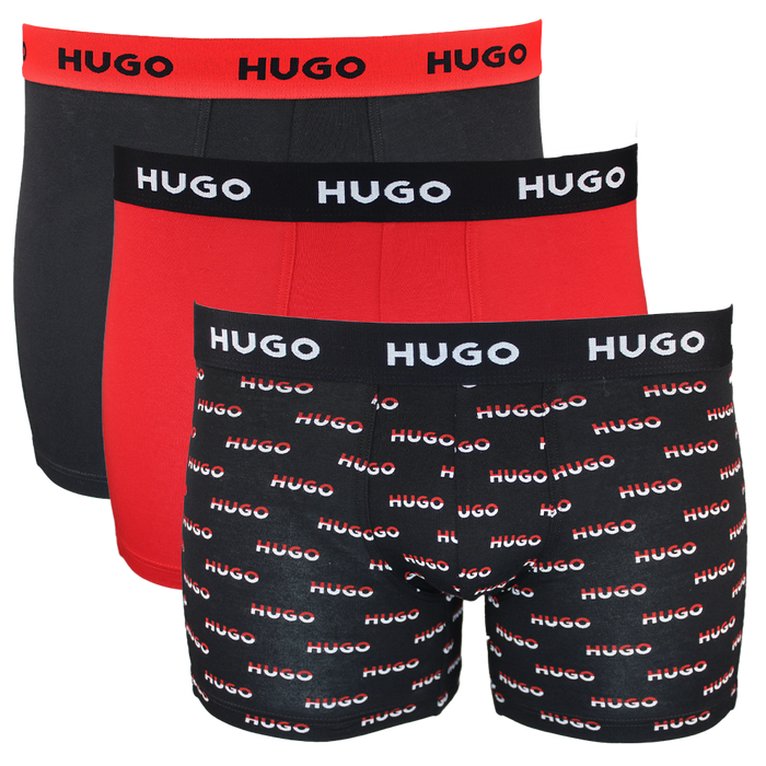 Three pairs of Hugo boxer briefs in black, red, and patterned designs on a white background.