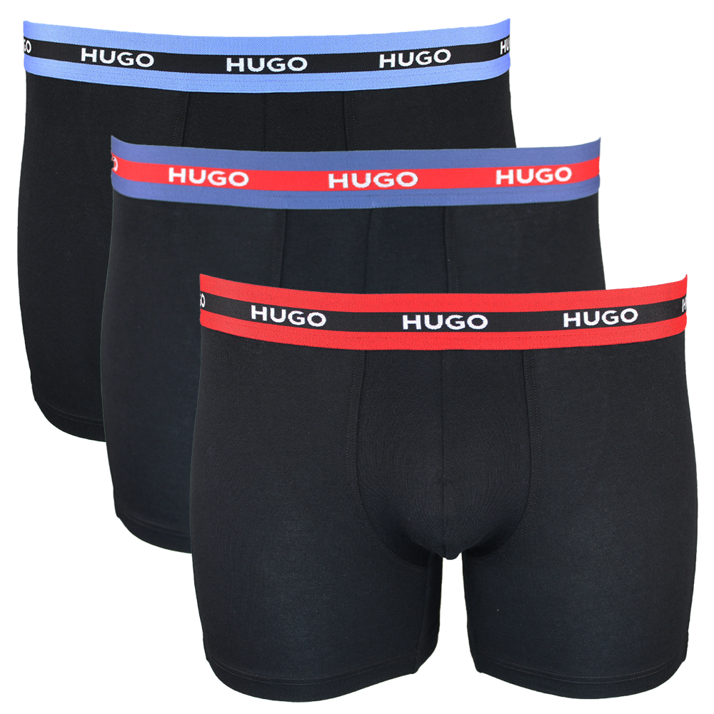 Three black boxer briefs with colorful 'HUGO' waistbands on a white background