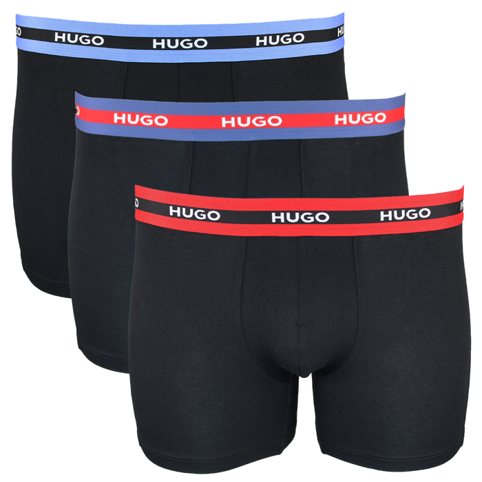 Three black boxer briefs with colorful 'HUGO' waistbands on a white background