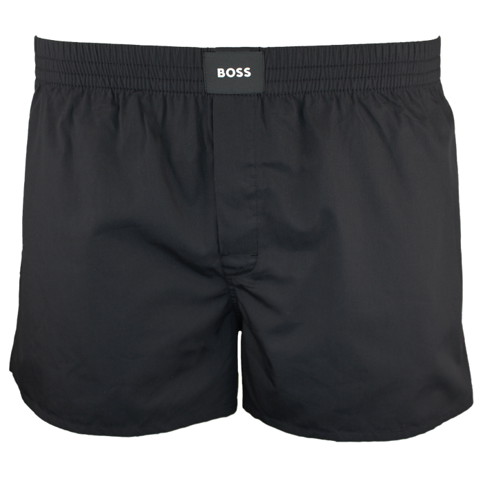 Black boxer shorts with 'BOSS' label on a white background