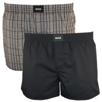 Two pairs of boxer shorts, one patterned and one black, with BOSS branding.