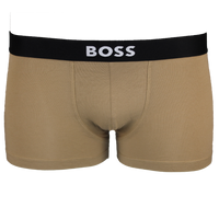 Beige boxer trunkss with a black waistband featuring the 'BOSS' logo on a white background.