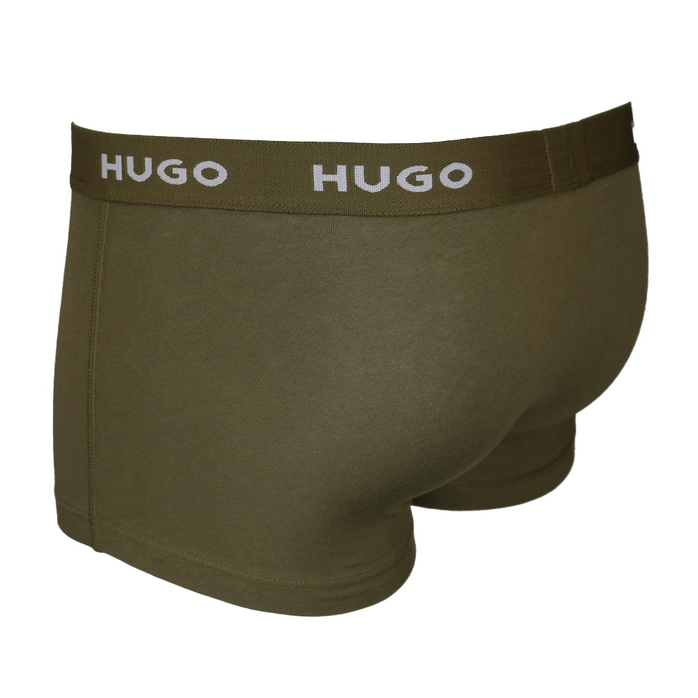 Green boxer briefs with 'HUGO' waistband on a white background