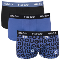 Three pairs of Hugo Boss boxer trunks in different styles on a white background.