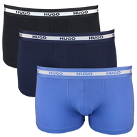 Three pairs of Hugo boxer briefs in black, navy, and blue with white waistbands on a white background.