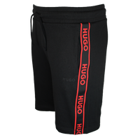 Black shorts with red Hugo branding repeated on leg