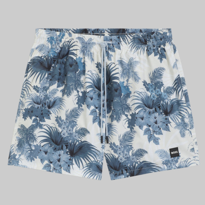 A pair of BOSS Piranha Swim Shorts in blue with a leafy floral pattern and an elasticated waistband.