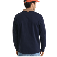 Back of man wearing a navy long-sleeve polo shirt with a brown collar, orange cap, and blue jeans on a white background.