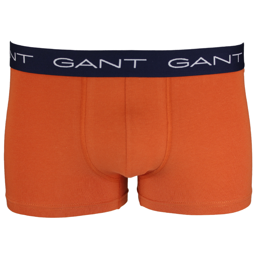 Orange boxer trunk with a black Gant waistband on a white background