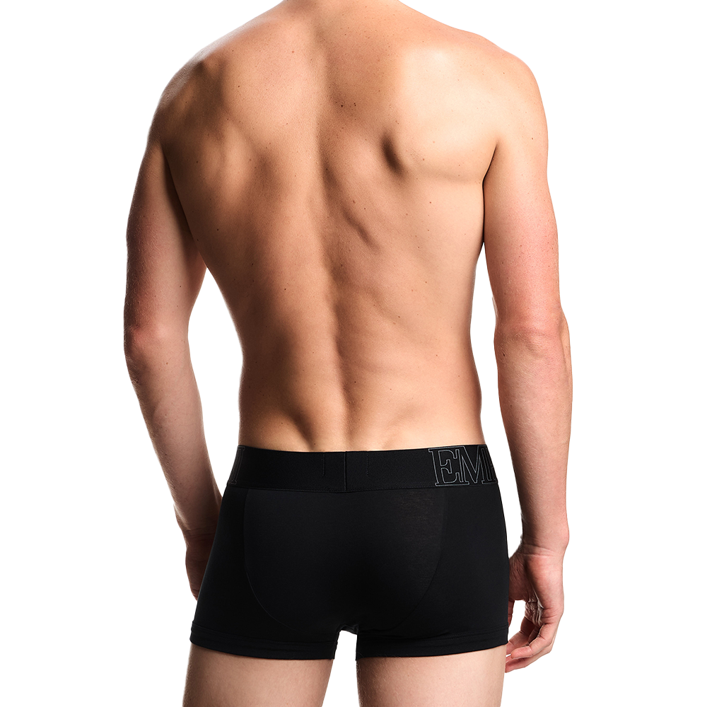 back view of a model wearing black Armani megalogo boxer trnks