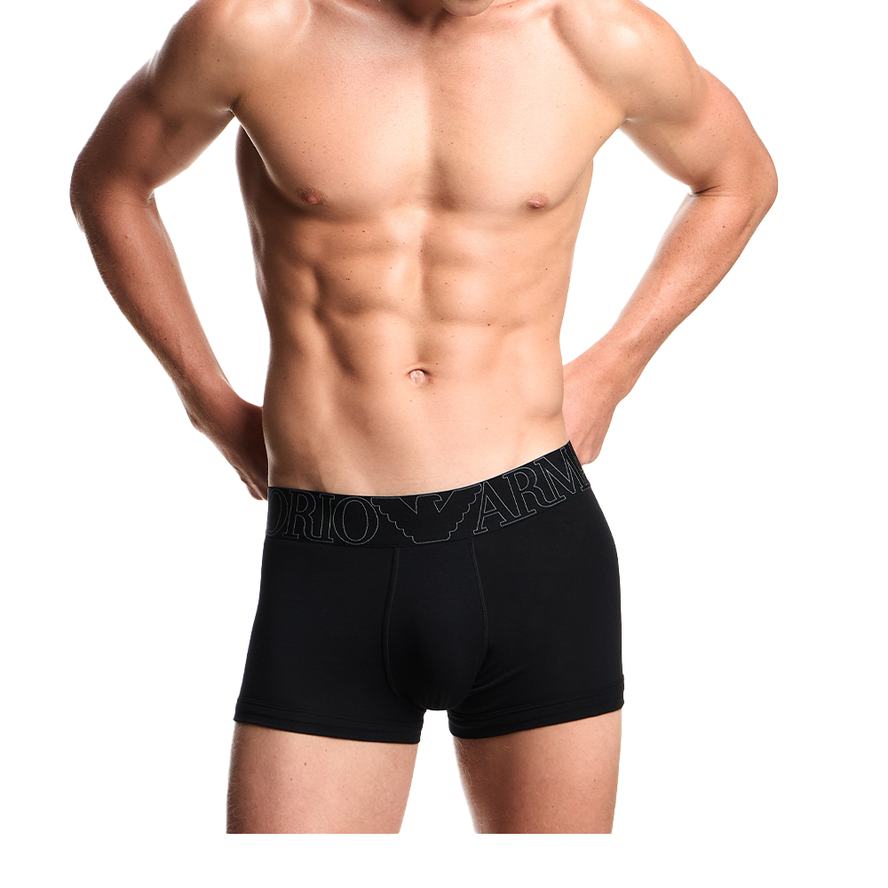a model wearing black Armani boxer trunks with megalogo