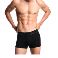 a model wearing black Armani boxer trunks with megalogo