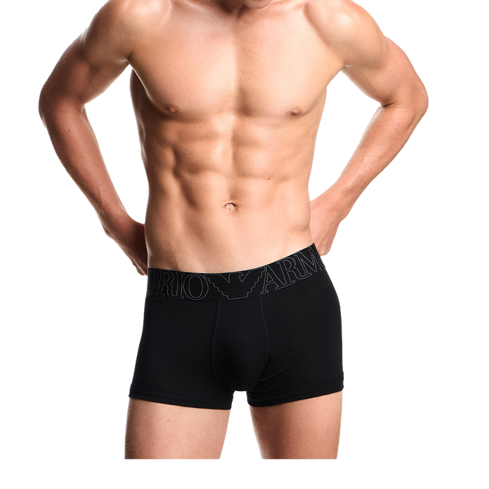 a model wearing black Armani boxer trunks with megalogo