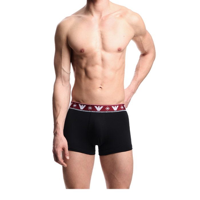 Black boxer trunks  with a red and white waistband on a white background