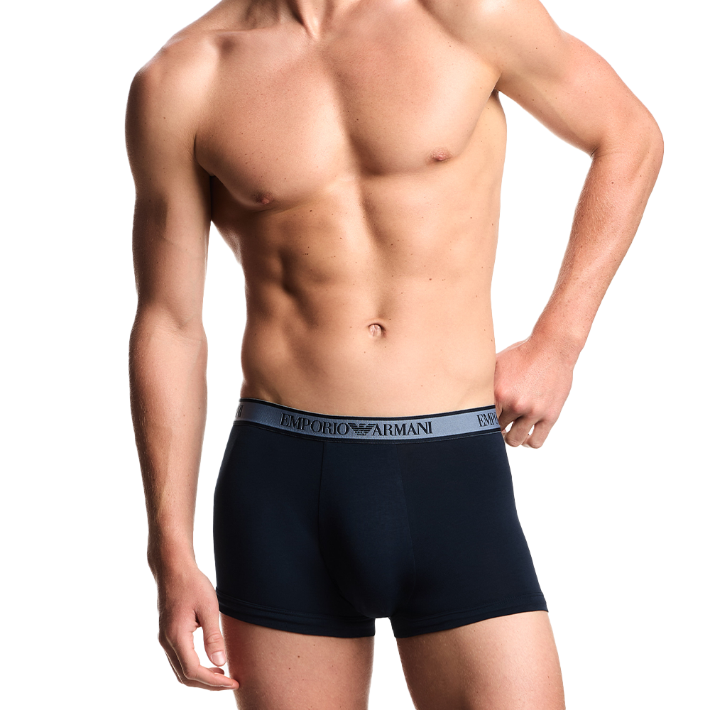 model wearing Armani blue boxer trunks