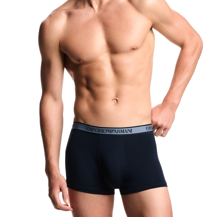 model wearing Armani blue boxer trunks
