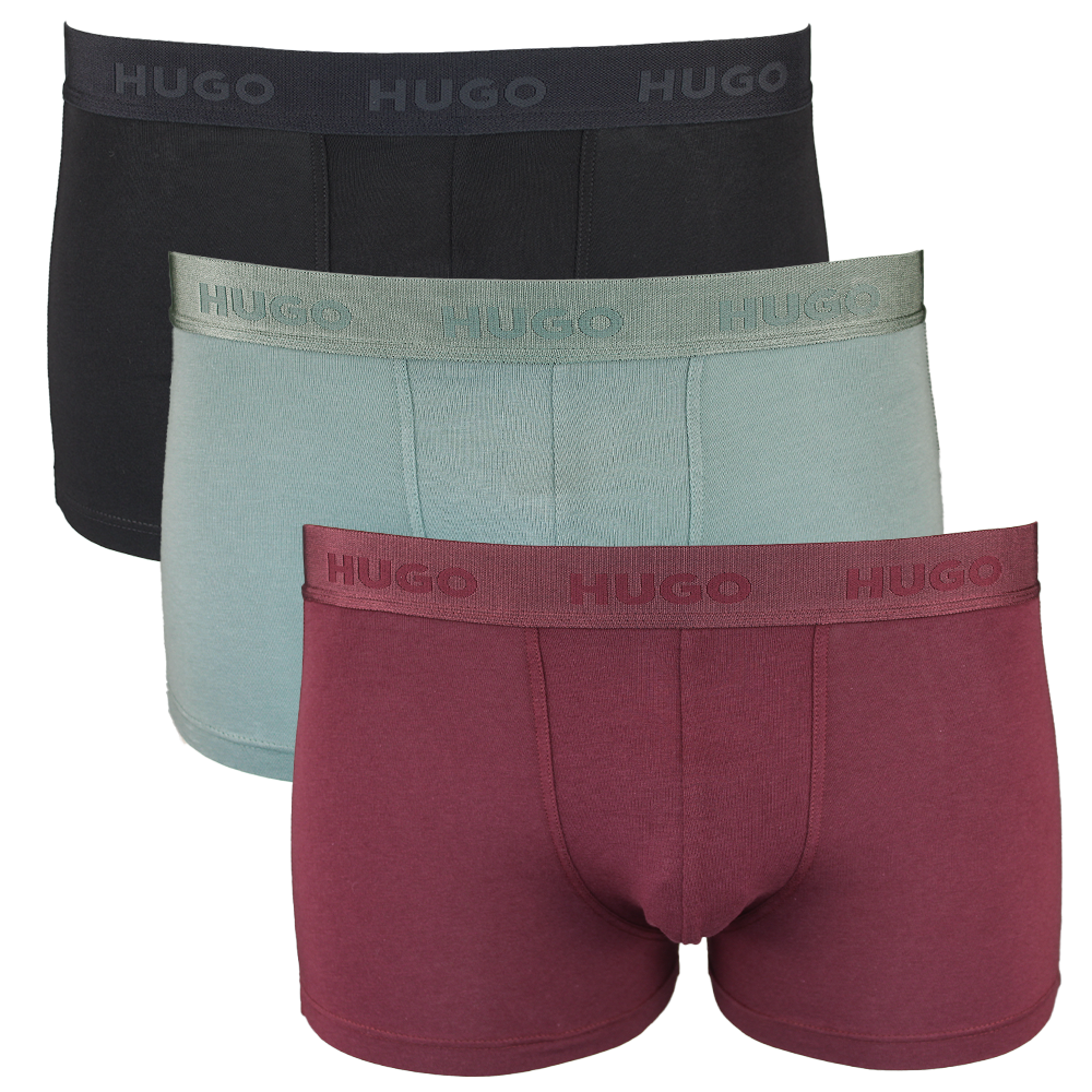 Three pairs of Hugo boxer briefs in black, green, and red on a white background.